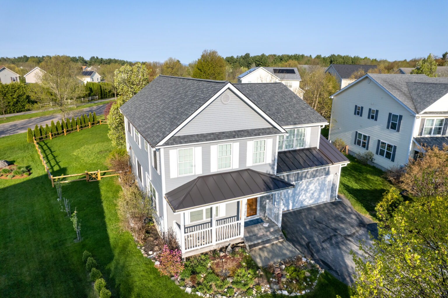 Single family home in South Burlington, Vermont with an asphalt shingle roof in estate Asphalt shingle residential roof replacement for a single-family home in South Burlington, Vermont, using Owens Corning TruDefinition Duration Architectural Shingles in estate grey.